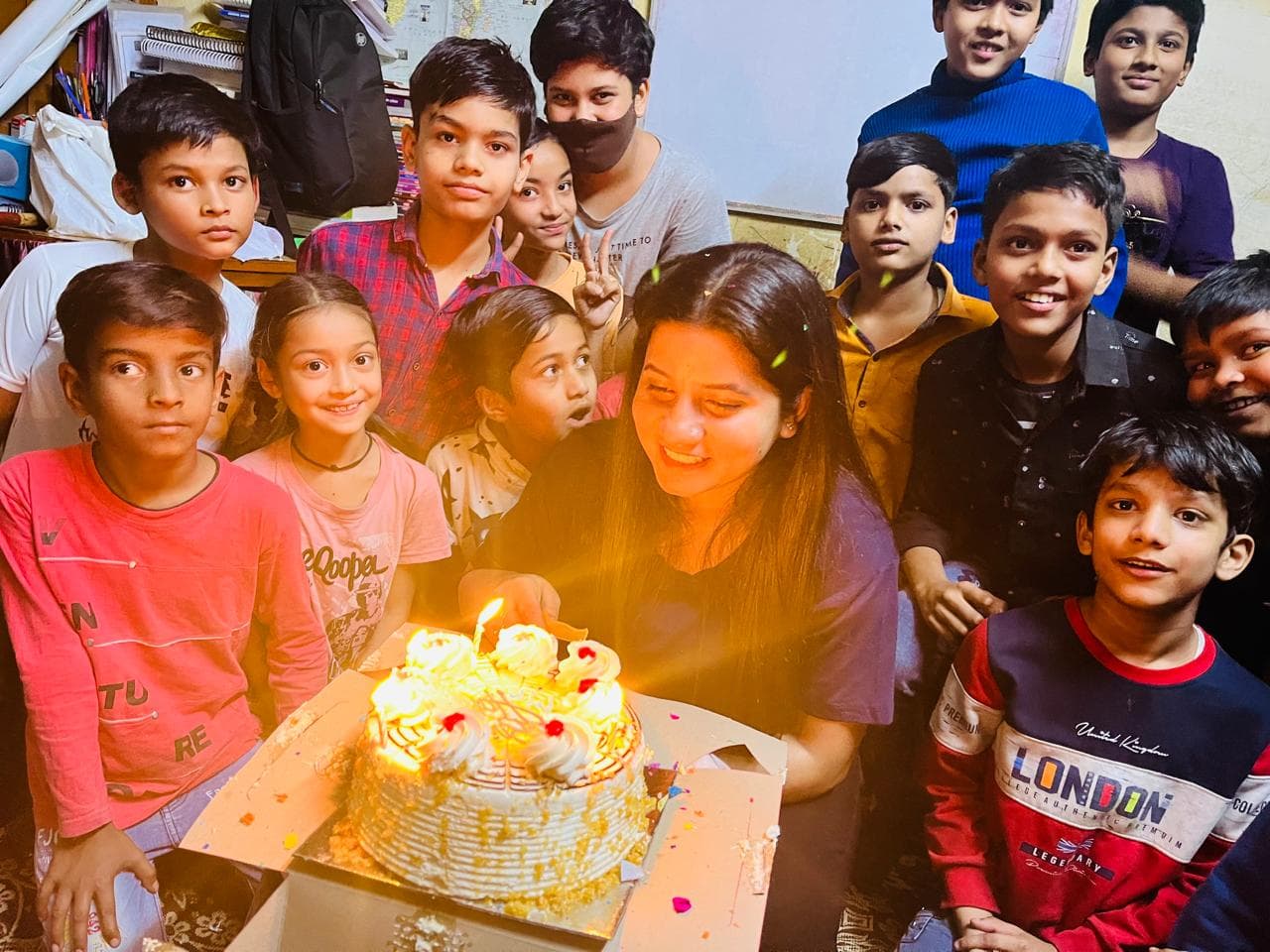 Tanuja Singh celebrating a student's birthday with the class